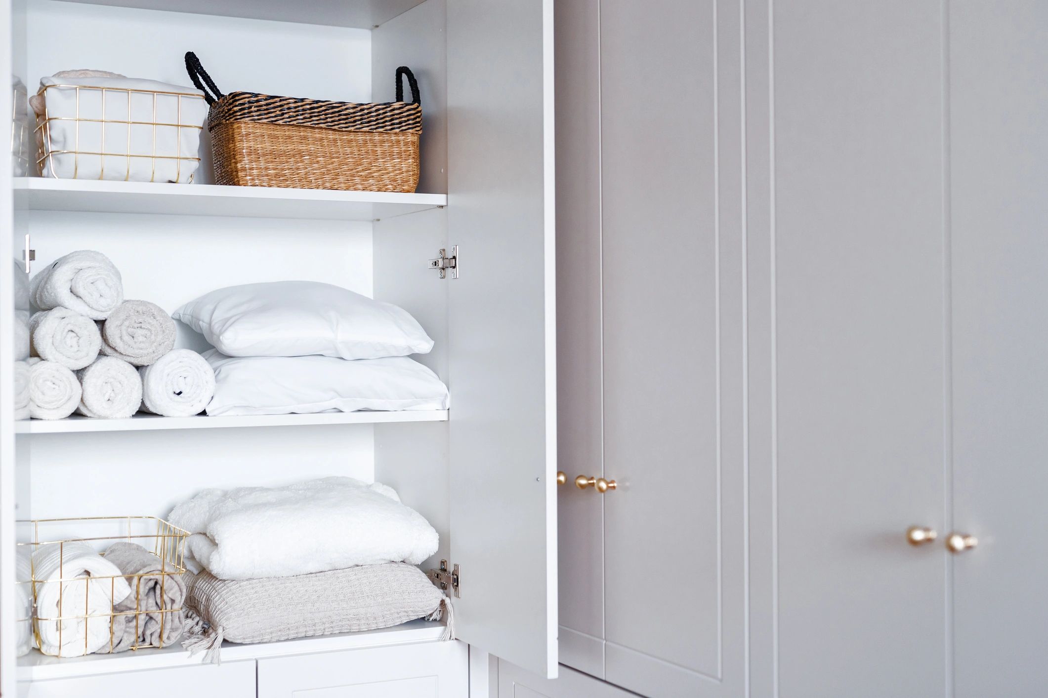 Linen cupboard doors and shelving installed with precision